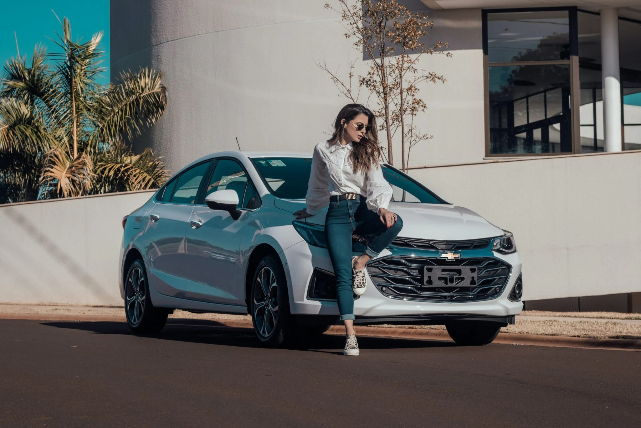 raphael-lovaski-GIGXTbZ_VPY-unsplash-scaled-2048x1366 lady sitting on the hood of a white car